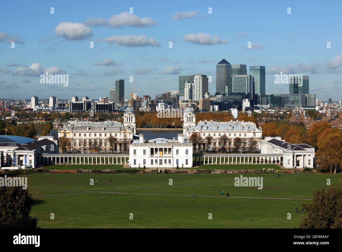 England - London - Greenwich - View from Greenwich Park in Autumn to the Royal Naval College, Queen`s House and the towers of Canary Wharf Stock Photo